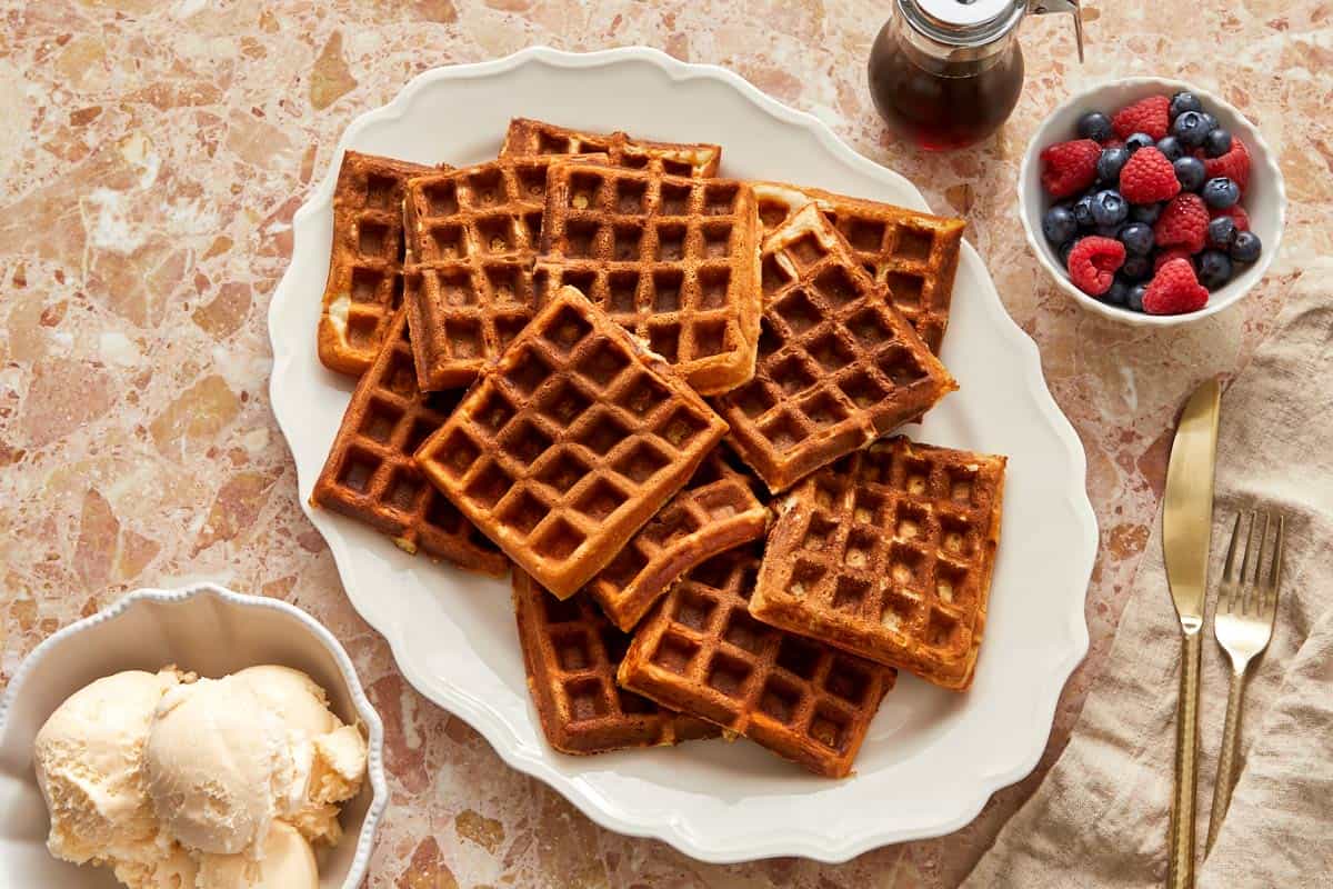 A tempting plate of Wancakes, ice cream, and a variety of berries on top.
