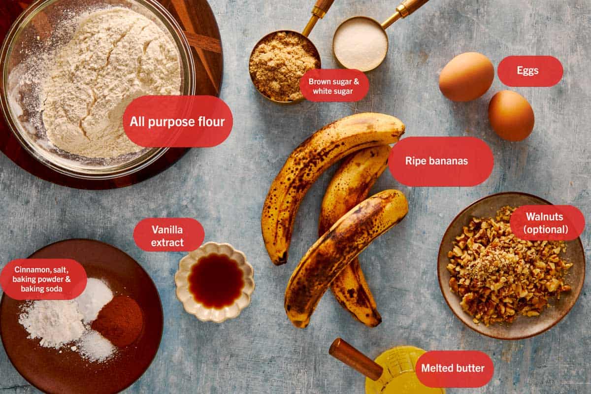 a top down view of all the ingredients needed to make banana bread resting in bowl on top of a grey bench