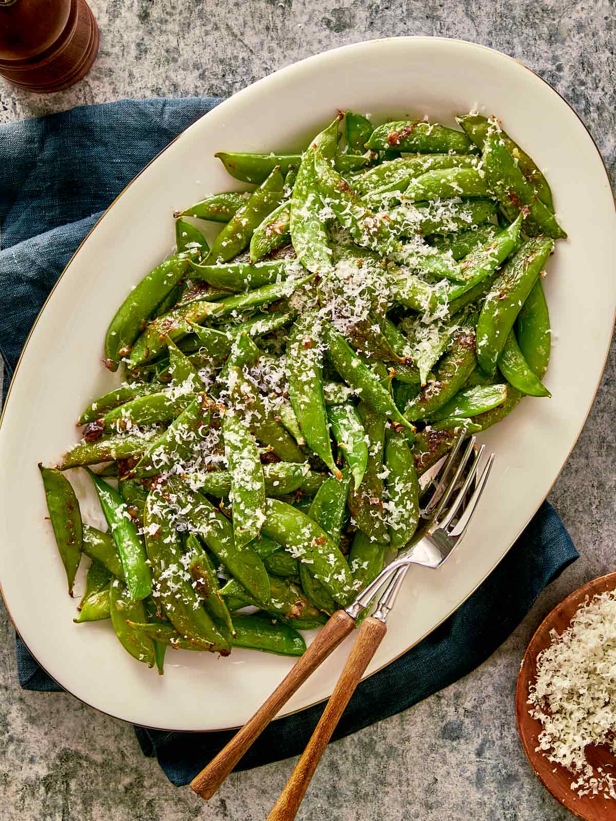overview top of served cacio e pepe with sugar snap peas