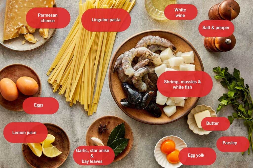 a top down shot of all the ingredients needed to make a creamy pasta seafood dish