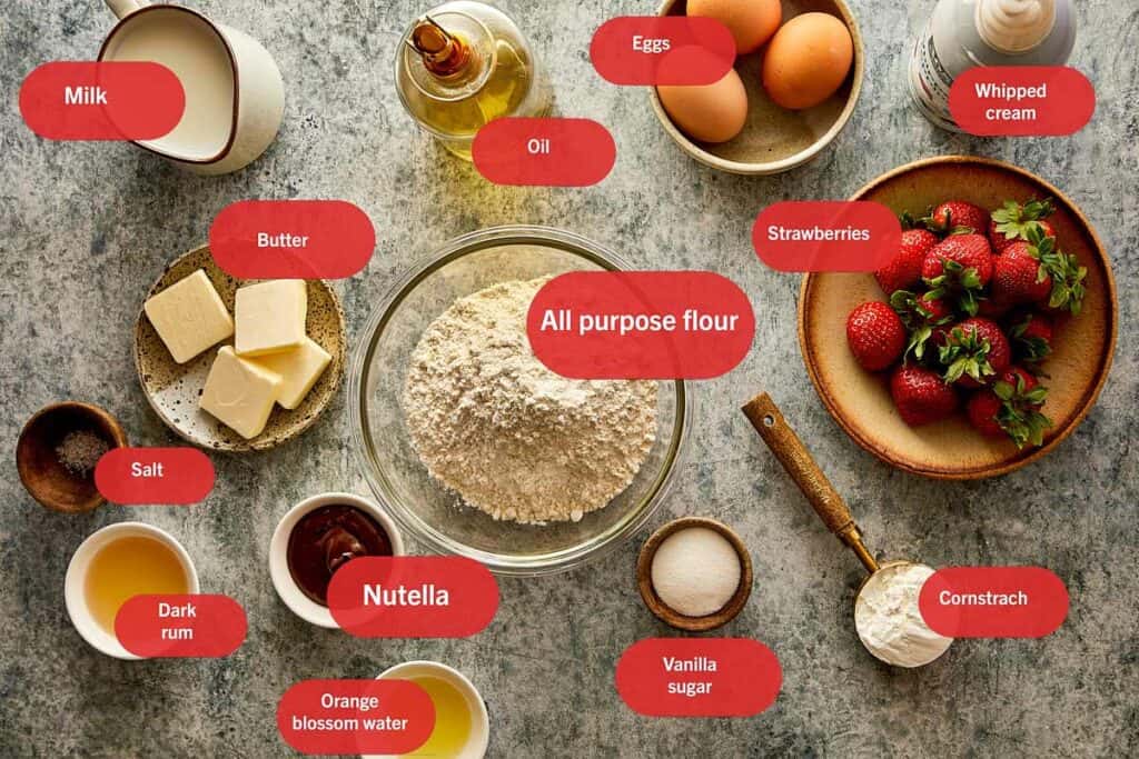 all the ingredients needed to make strawberry and nutella crepes in bowls.