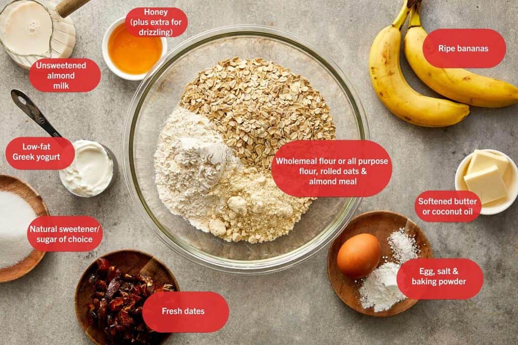 a top down shot of all the ingredients needed to make the muffin starting with all the flours in a mixing bowl in the middle and other ingredients in bowls around it.