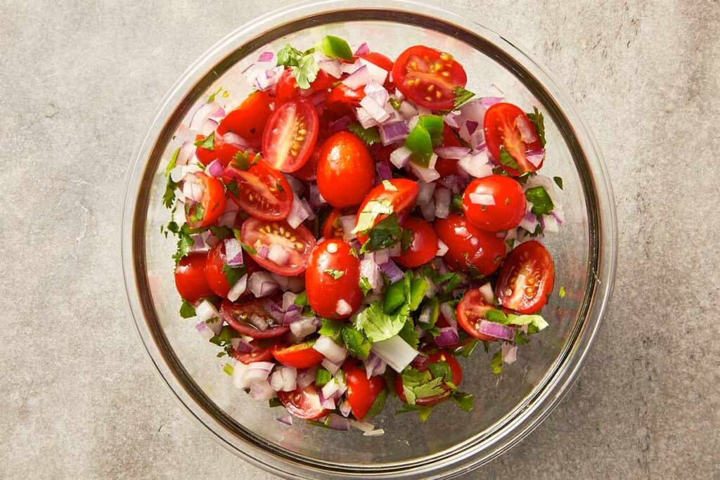 Top overview of pico de gallo (salsa) in a bowl.
