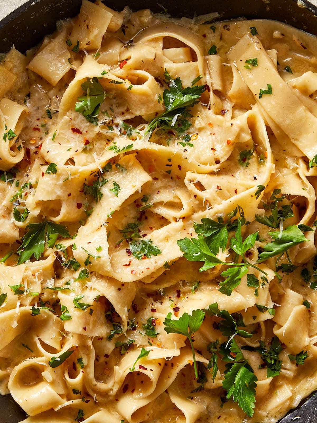 Brown butter Alfredo pasta with fettuccine in a creamy parmesan sauce, finished with fresh parsley and chilli flakes.