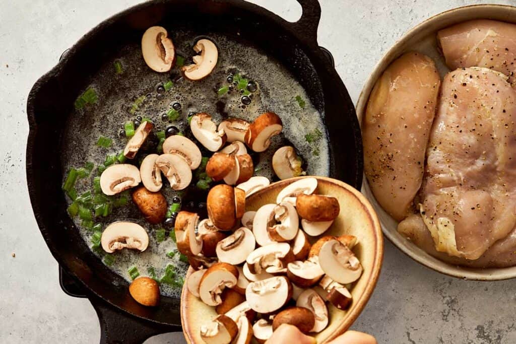 Adding mushrooms to the pan with butter and shallots