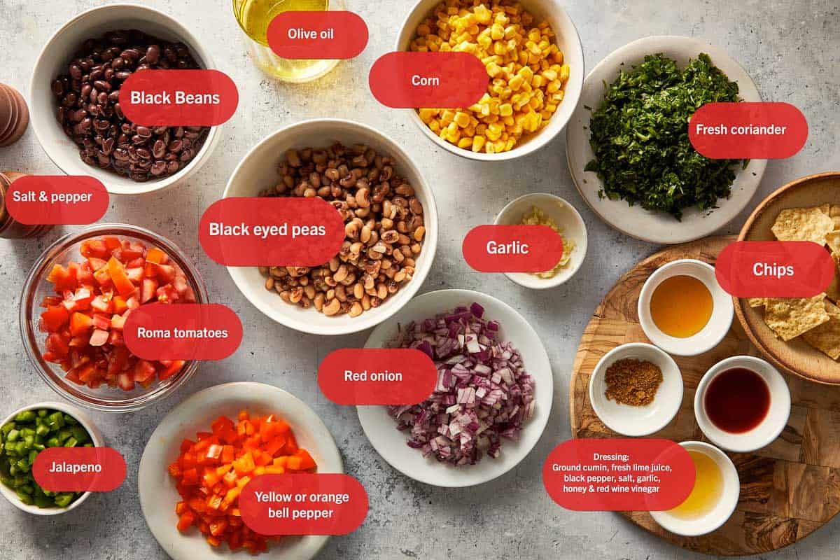 Ingredients for black eyed pea salad in a white surface