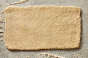 Folded buttermilk biscuit dough ready to be cut | CafeDelites.com