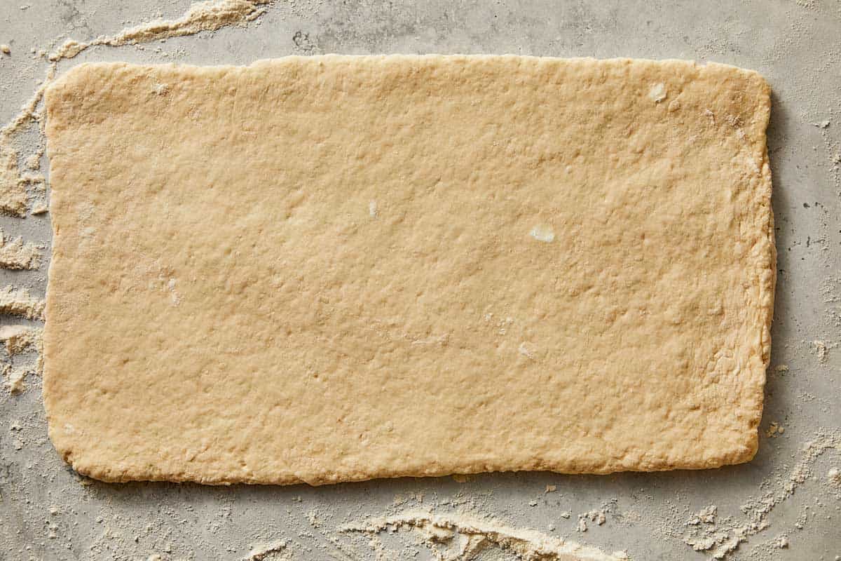 Folded buttermilk biscuit dough ready to be cut | CafeDelites.com