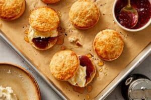 Served Buttermilk Biscuits filled with jam and whipped cream | CafeDelites.com