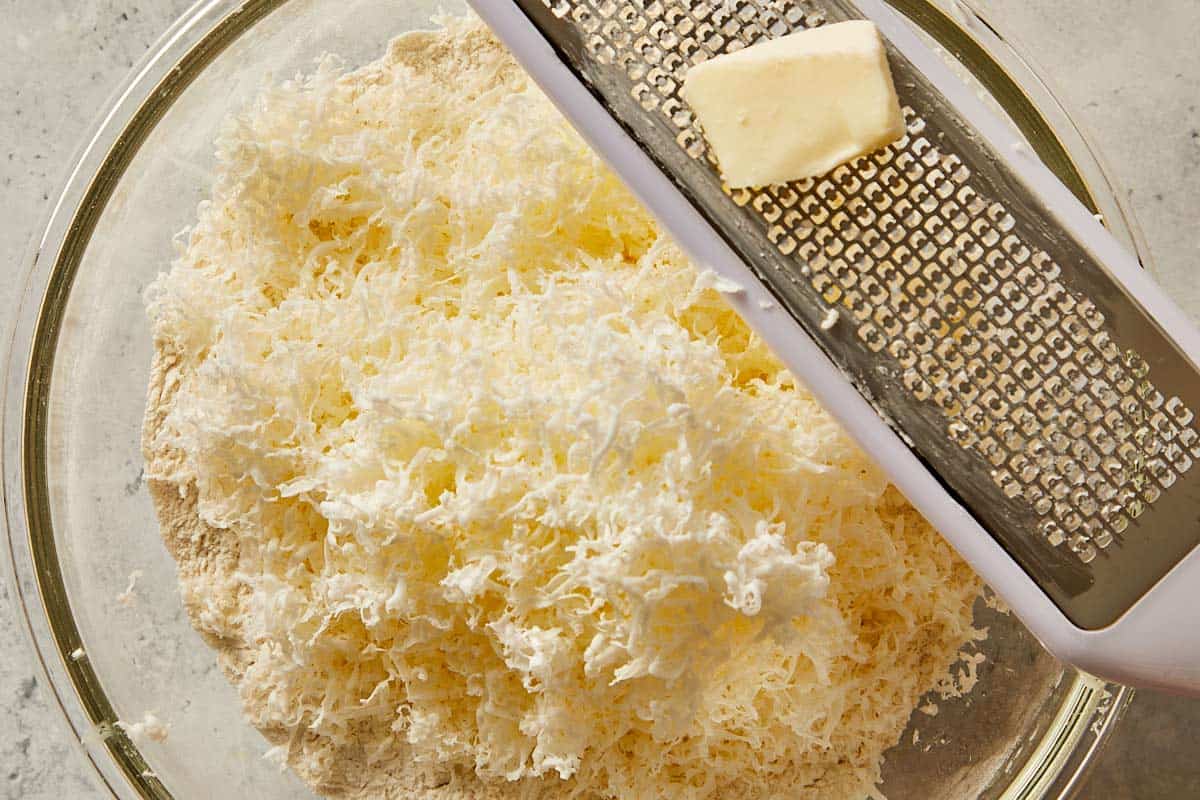 shredded butter in the dry ingredients for biscuits dough | CafeDelites.com