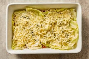 Thick beef and passata sauce simmering in a skillet for cabbage lasagna.