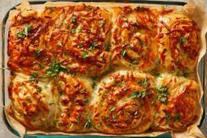 Freshly baked cheesy garlic butter rolls topped with parsley
