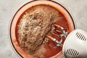 adding dry ingredients to the mix