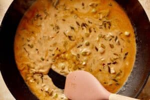 Whisking with chicken stock, lemon juice, Worcestershire sauce, and cream