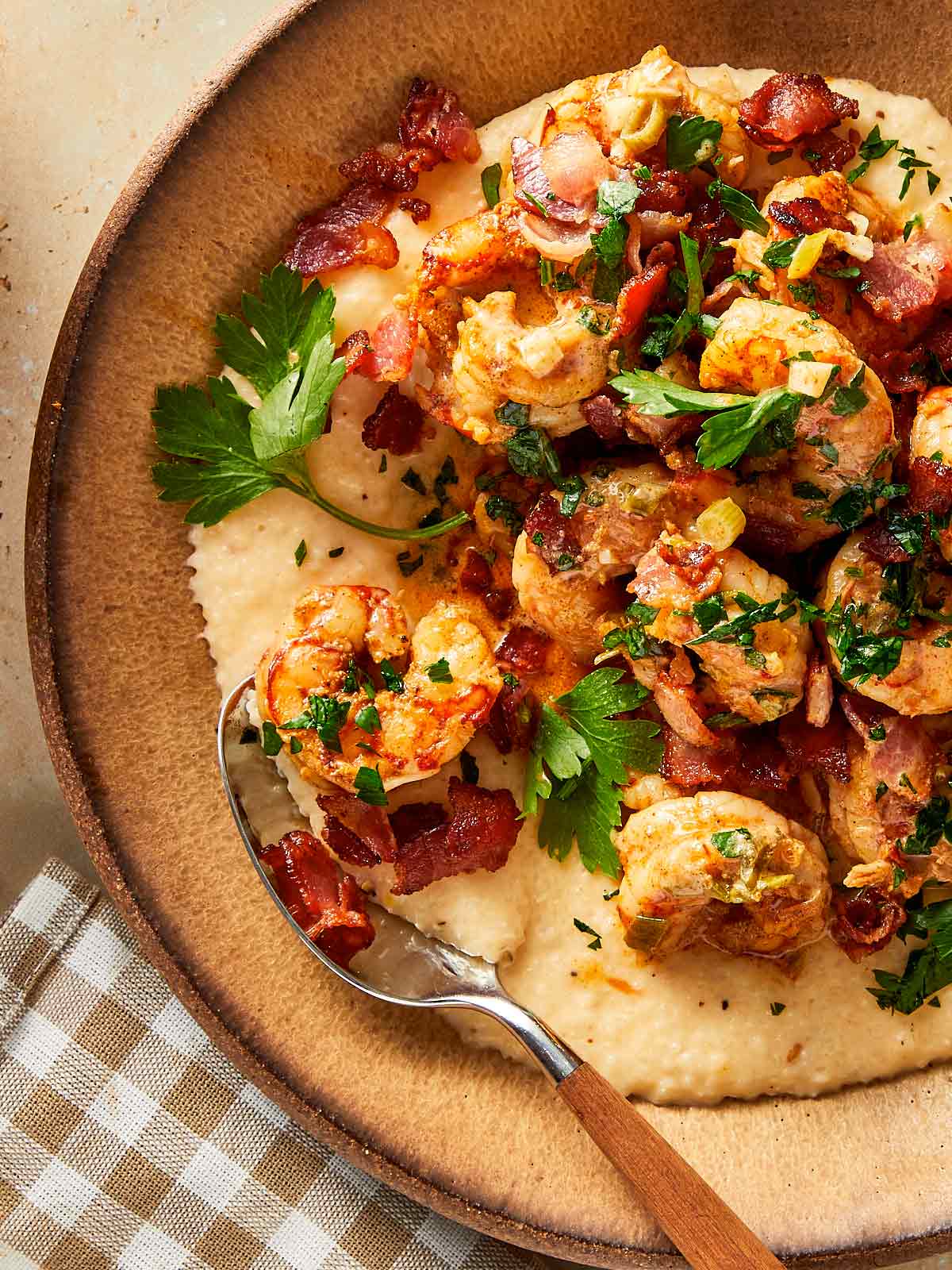 close up of a plate with shrimp and grits ready to eat
