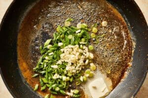 Same pan with butter, garlic, and scallions