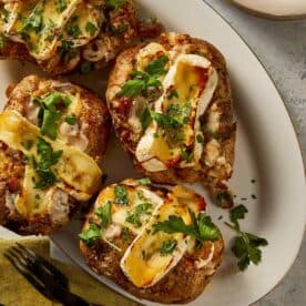 Loaded baked potatoes in a plate ready to eat