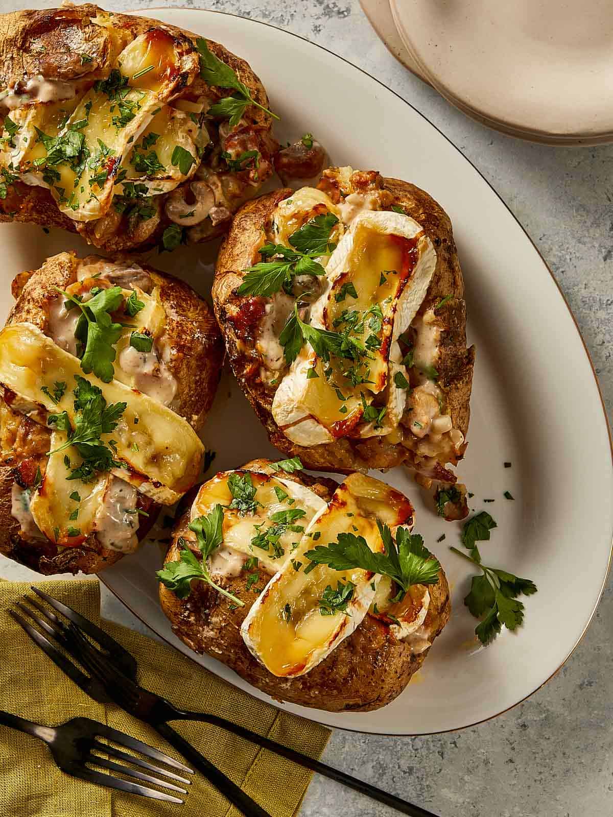 Loaded baked potatoes in a plate ready to eat