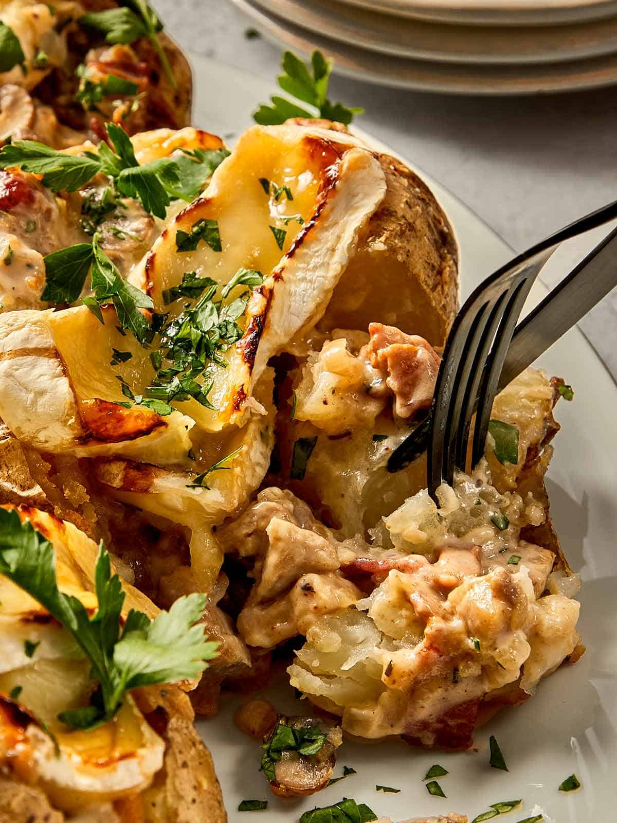 Fork with baked potato ready to be eaten