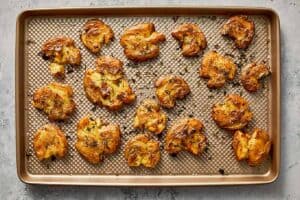 baked smashed potatoes in a baking sheet