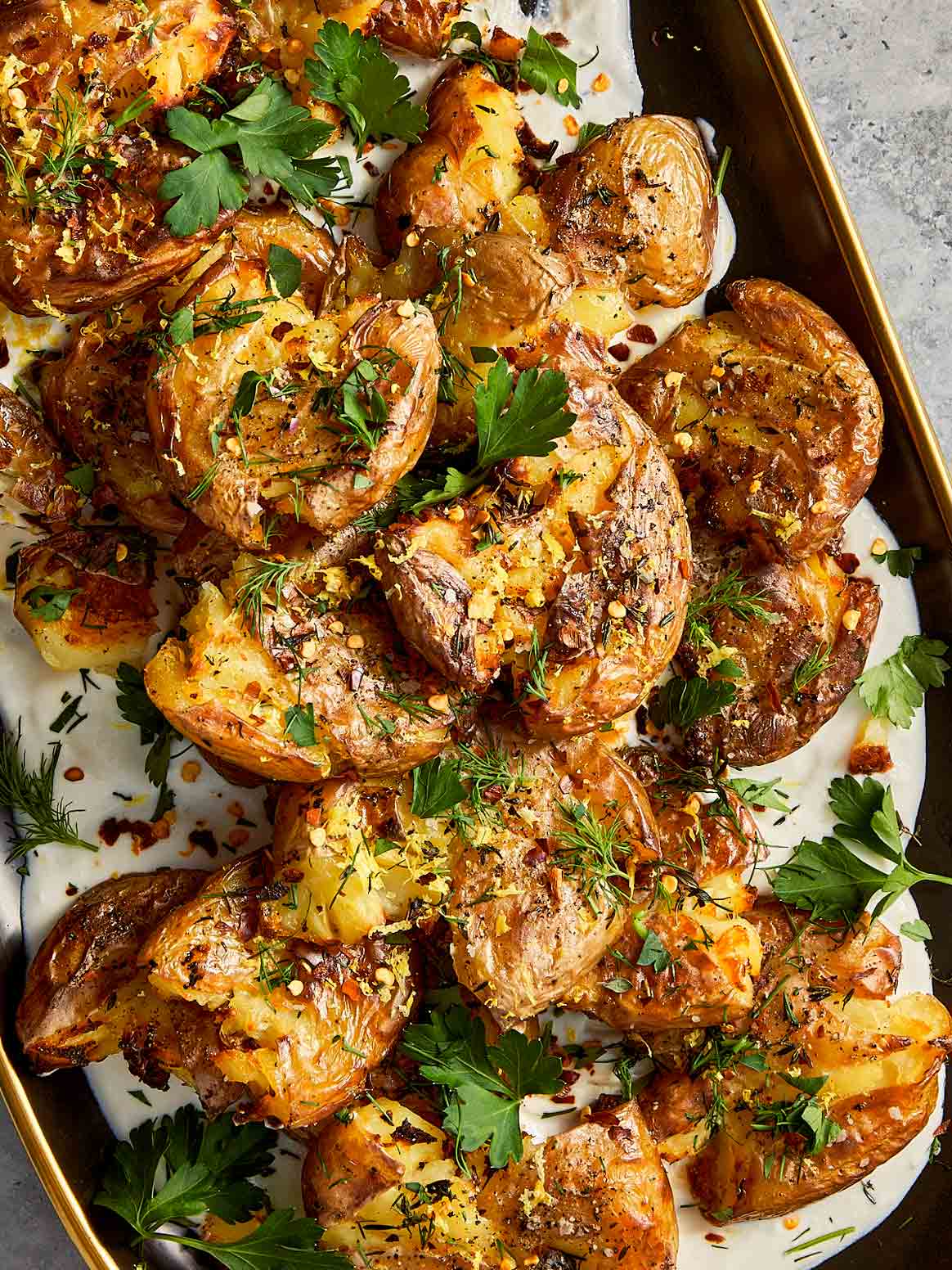 Close Up of Smashed Potatoes with lemon and whipped feta 