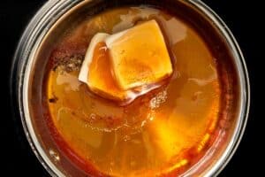 Butter melting into the hot sauce mix