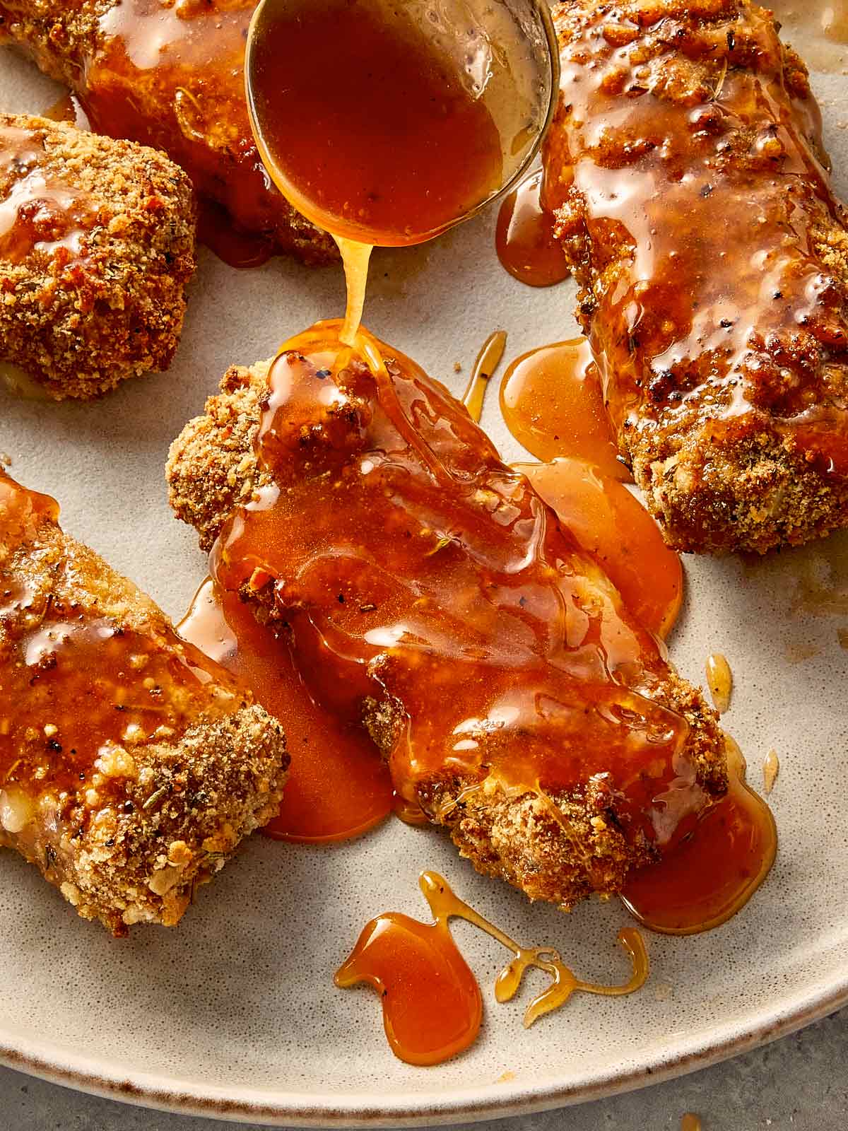 Cheese Stick being drizzled with hot honey sauce