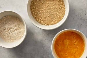 Breading station. 3 bowls showing flour, eggs and breadcrumbs