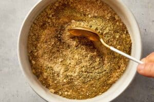 Breadcrumbs being mixed with spices