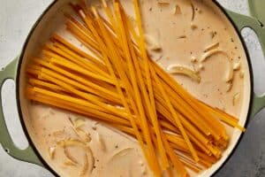 raw pasta into the cream ready to be cooked