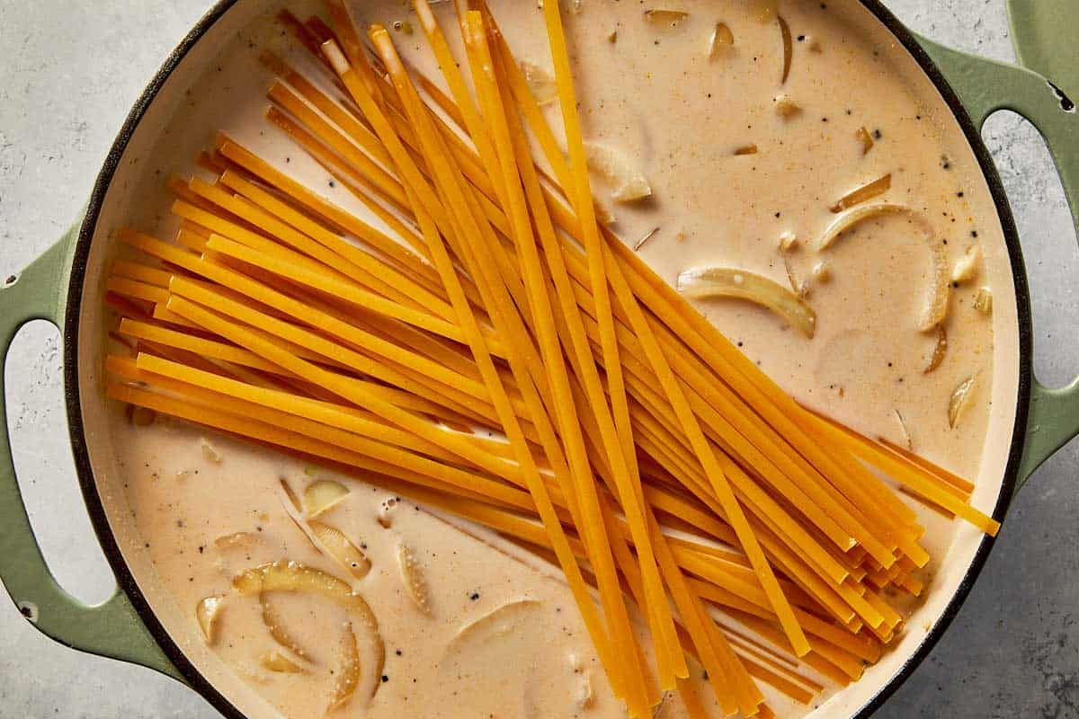 raw pasta into the cream ready to be cooked