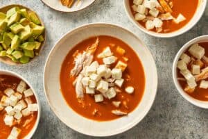 soup, cheese and chicken in a plate for serving