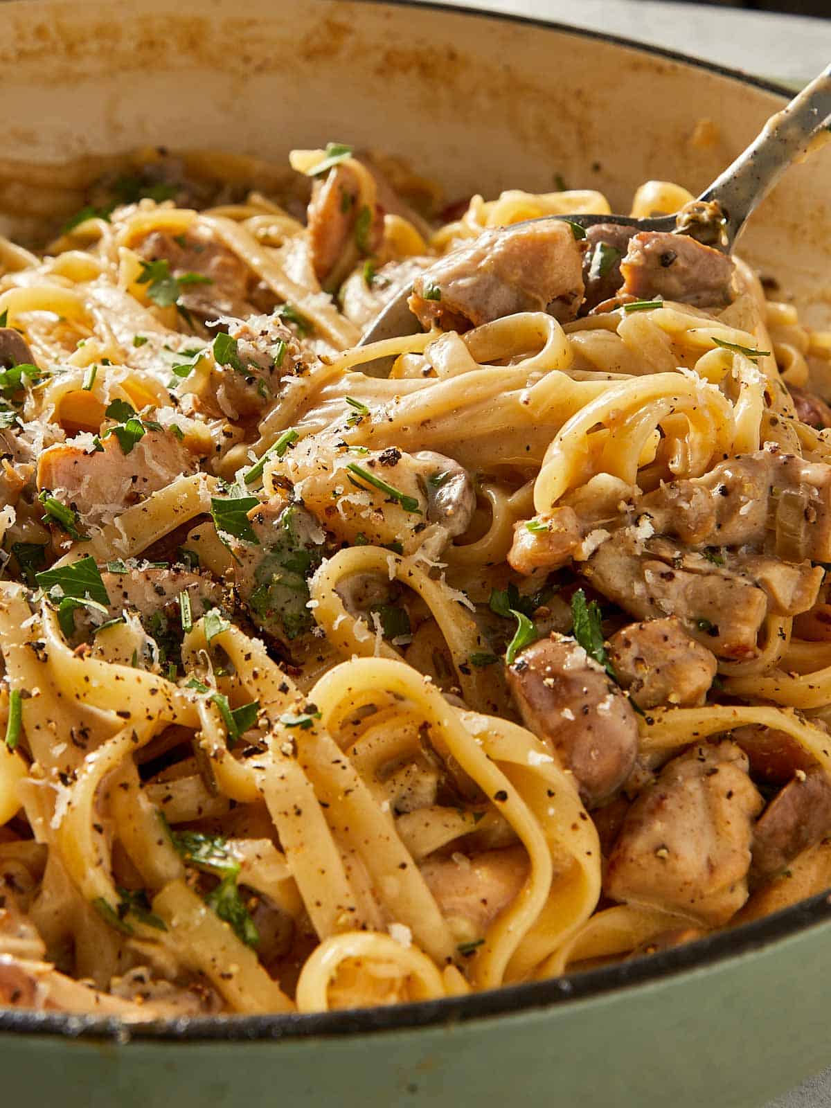 Fork with chicken Alfredo ready to eat