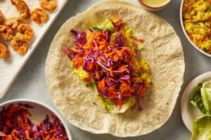 Tortilla with slaw, shrimp, lettuce and rice