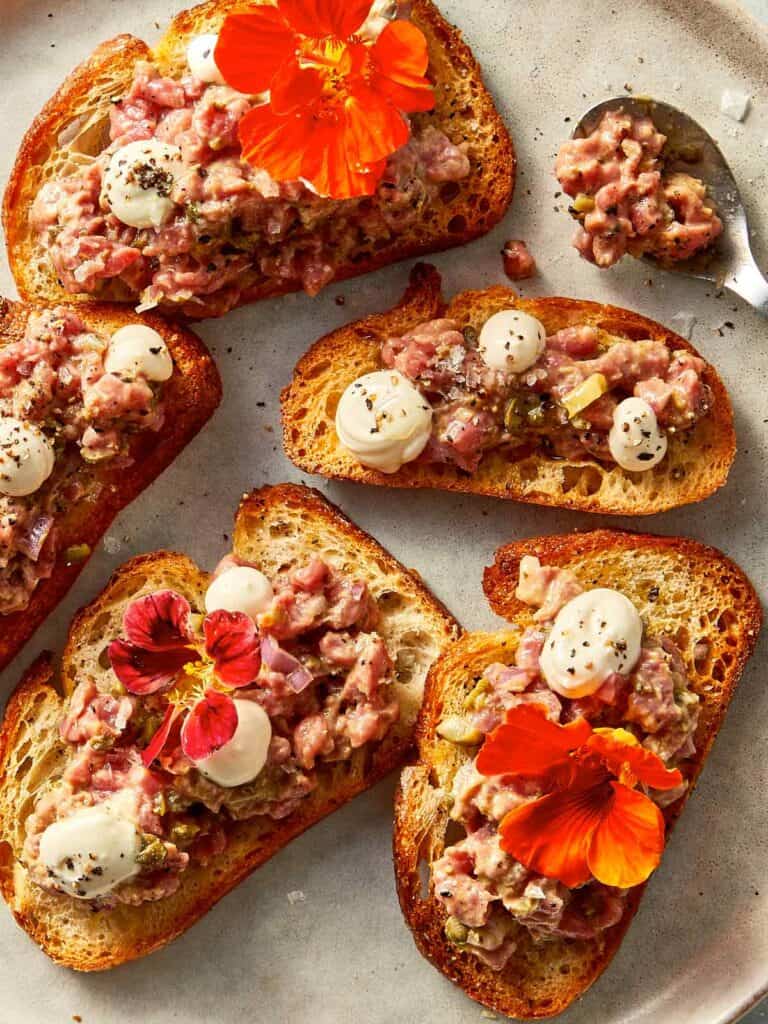 finished steak tartare ready to eat in toasts
