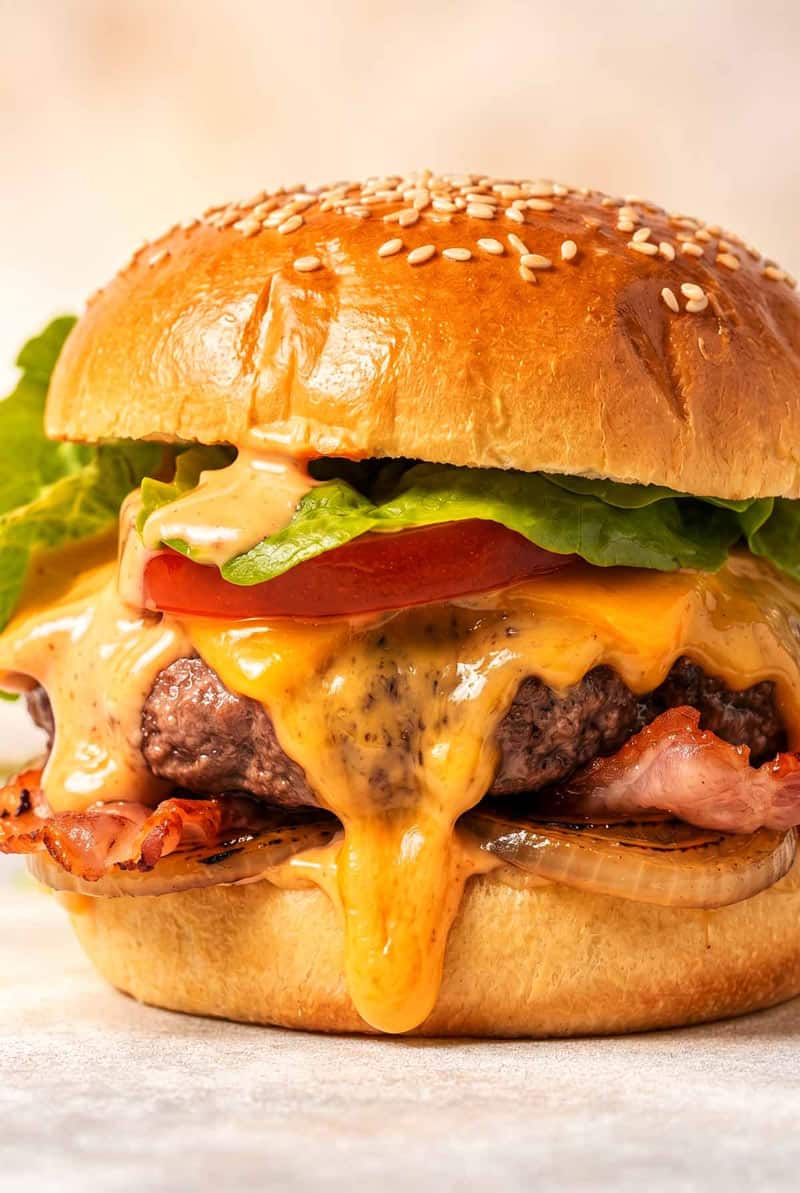 shot of beef burger with melty cheese